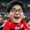 一位戴眼镜的中国男性球迷头像